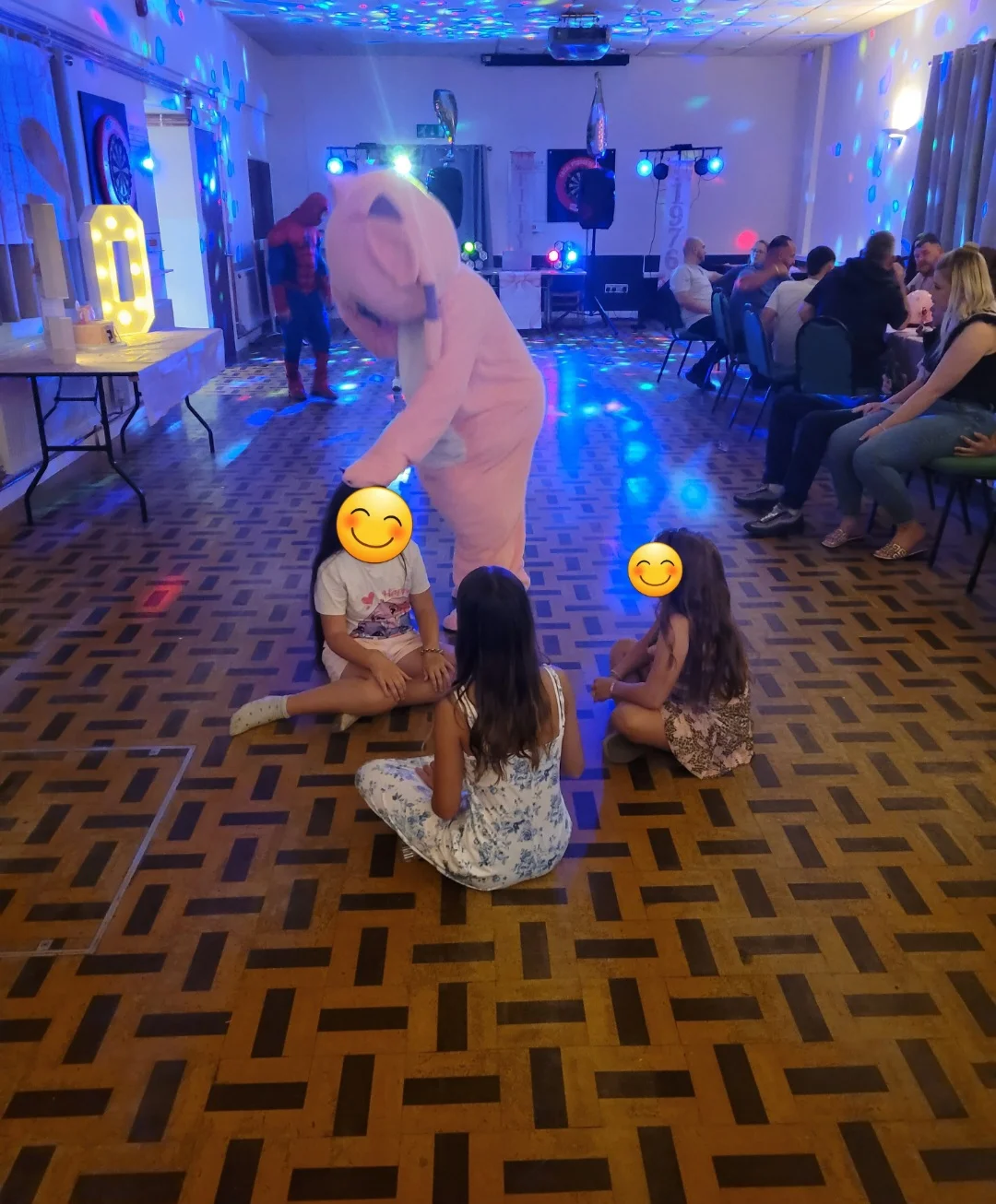 Pink pig character mascot in a red outfit